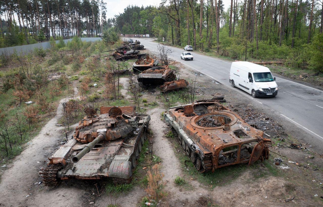 Cars pass by destroyed Russian tanks in a recent battle against Ukrainians in the village of Dmytrivka, close to Kyiv, Ukraine, Monday, May 23.