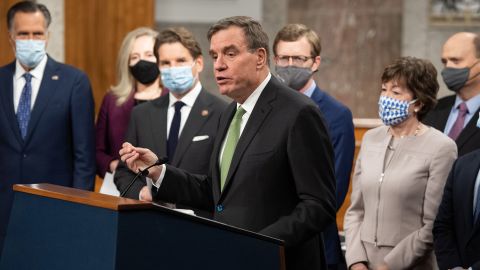 Sen. Mark Warner speaks alongside a bipartisan group of Democrat and Republican members of Congress on Capitol Hill on December 1 in Washington, DC.