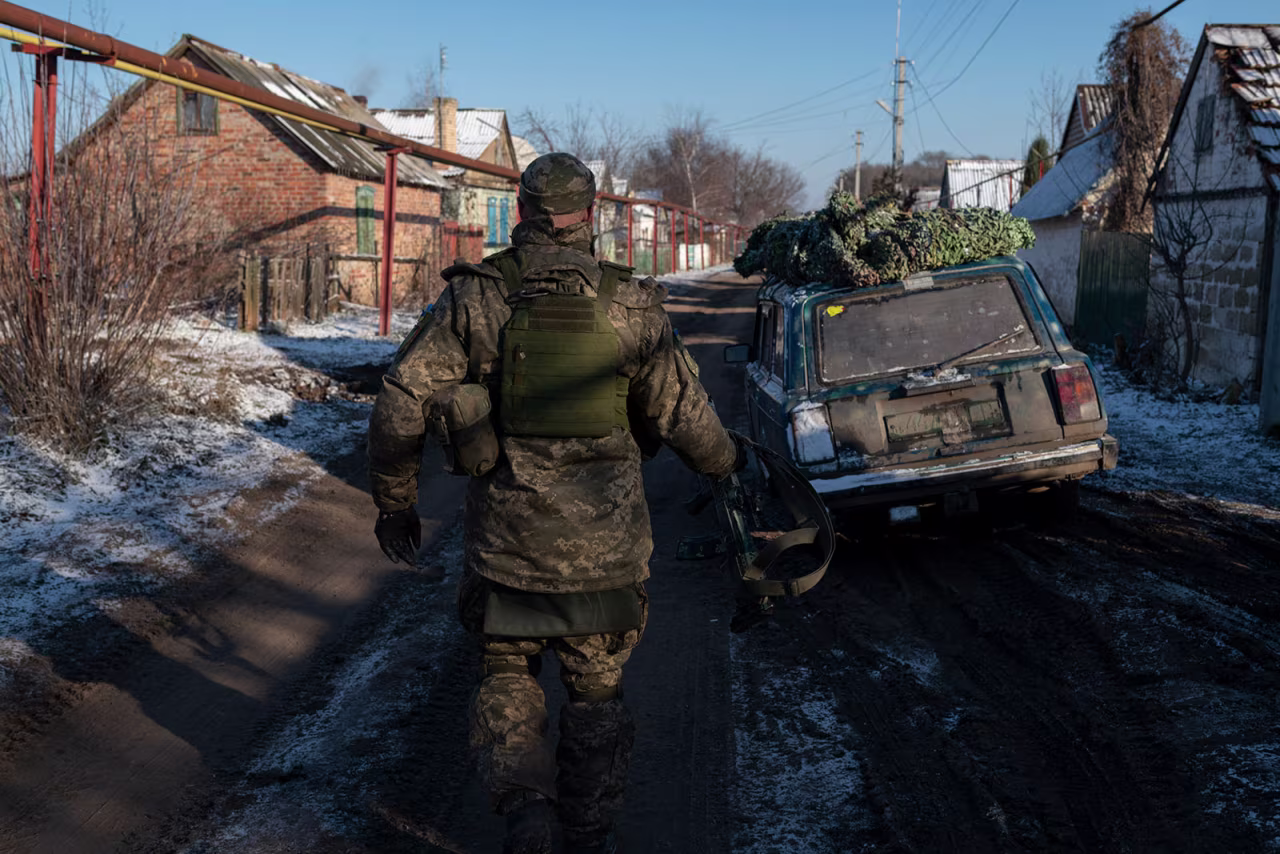 A Ukrainian military member walks a street in Krasna Hora, Ukraine, on January 7. 