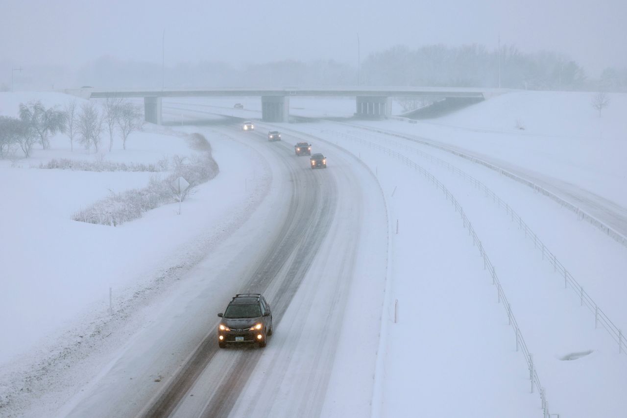 Vehicles drive slowly along I-80 in Des Moines on Tuesday.