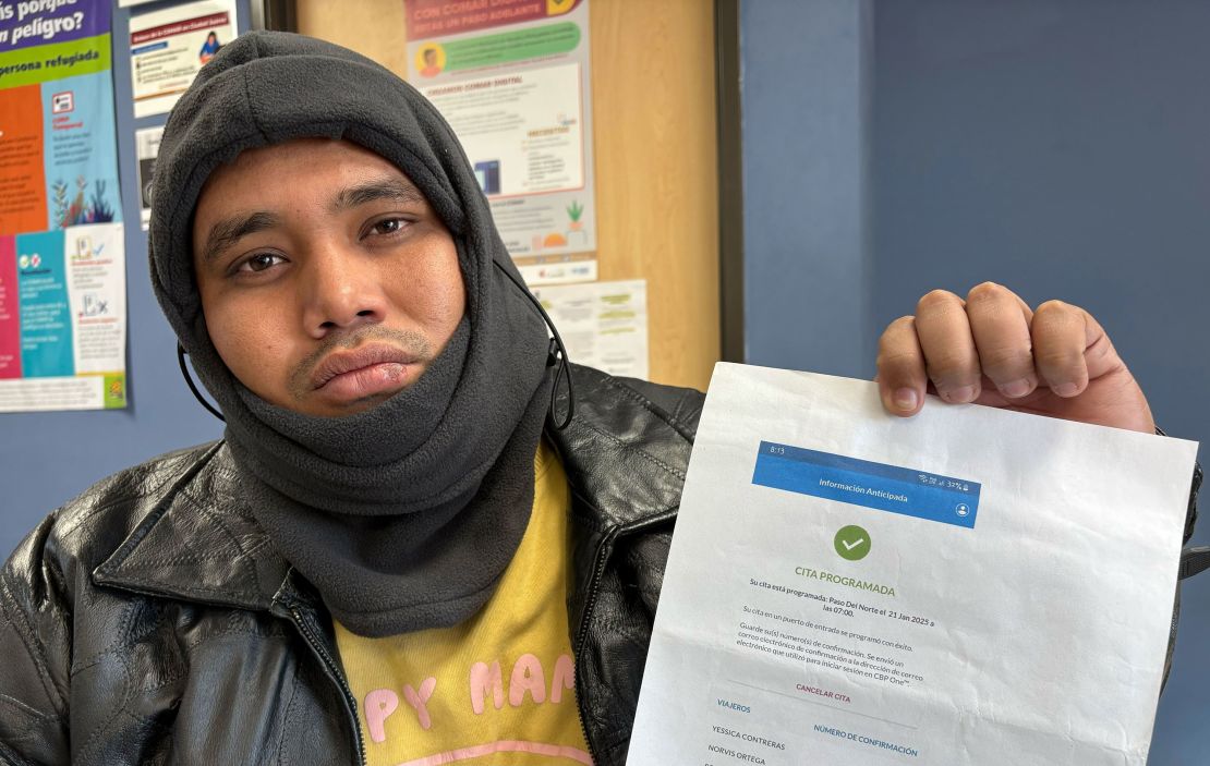 Venezuelan migrant Jose Guillermo Cabera shows his CBP One appointment confirmation for Tuesday, January 21