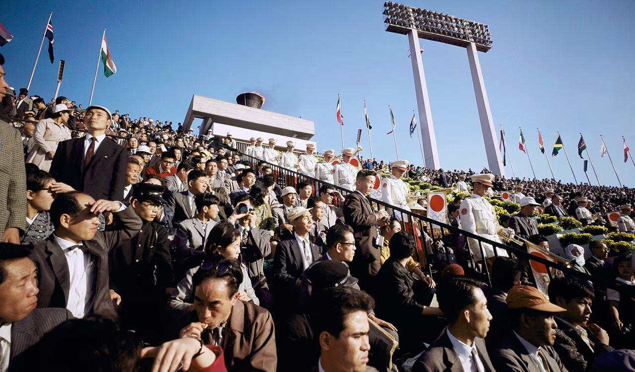 People attend the opening ceremony of the 1964 Tokyo Olympics.