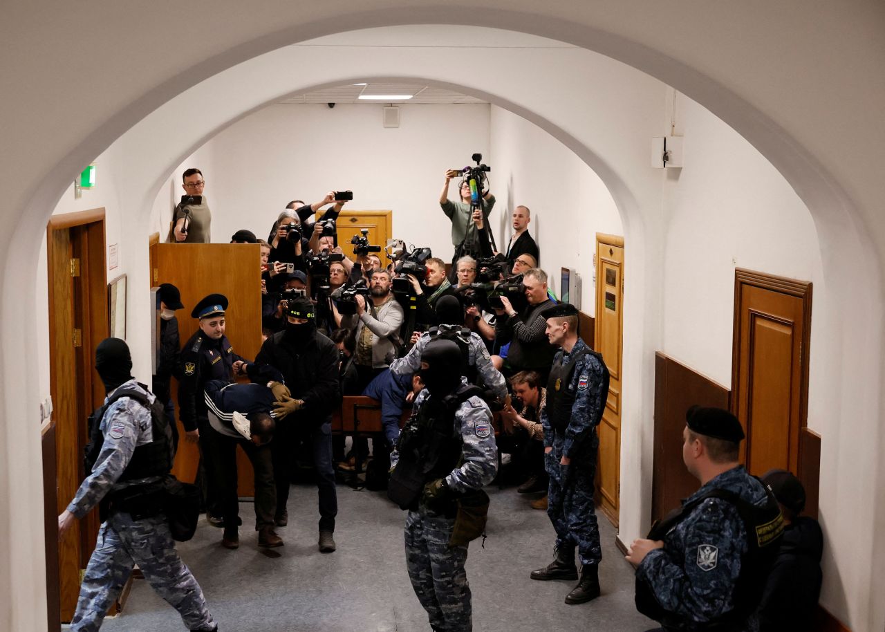 Saidakrami Murodali Rachabalizoda, a suspect in the shooting attack at the Crocus City Hall concert venue, is escorted following a court hearing at the Basmanny district court in Moscow, Russia, on March 24.