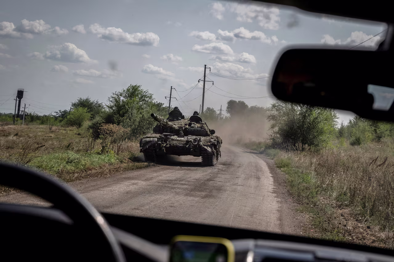 Ukrainian servicemen ride a tank near the village of Robotyne, Zaporizhzhia region, Ukraine, on August 25.