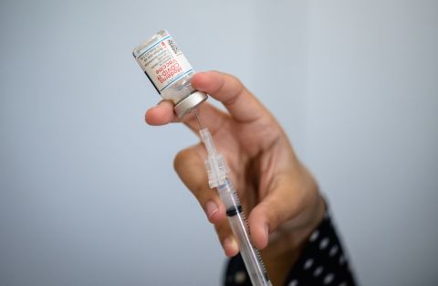 A medical staff member prepares a syringe with a vial of the Moderna Covid-19 vaccine at a pop up vaccine clinic at the Jewish Community Center on April 16 in New York City. 