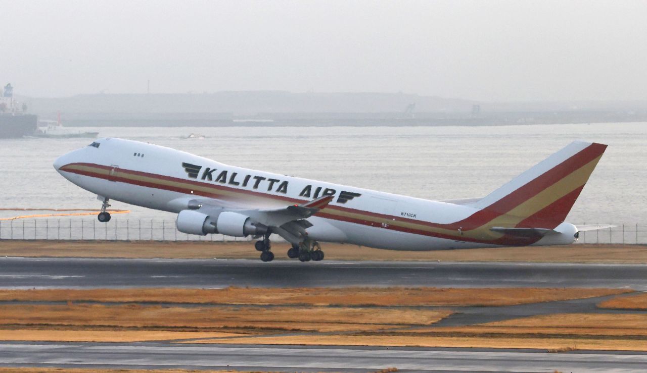 A US government-chartered plane takes off from Tokyo's Haneda airport on Monday carrying American citizens evacuated from the coronavirus-hit Diamond Princess cruise ship.