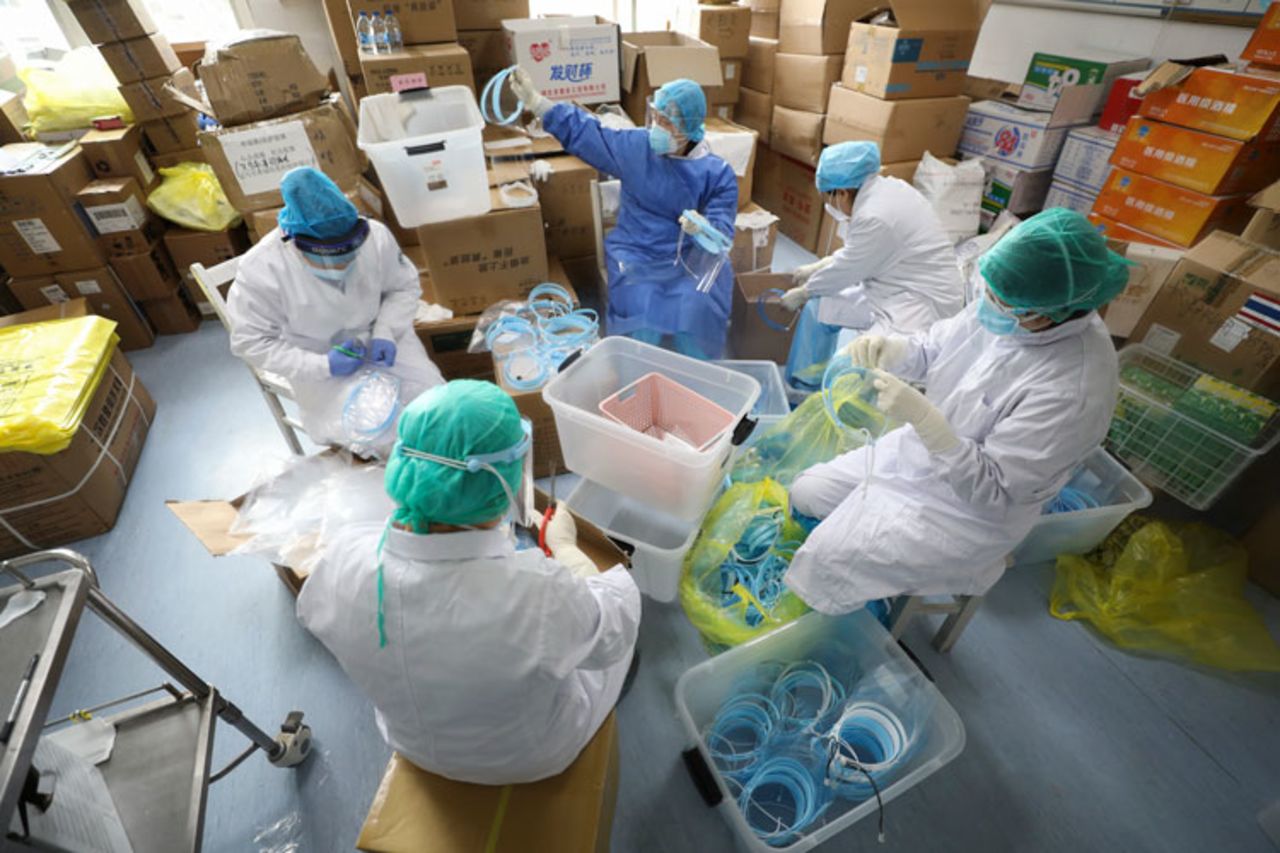 Nurses assemble plastic face shields at a hospital designated for the coronavirus patients in Wuhan in central China's Hubei province, Sunday, March 1.