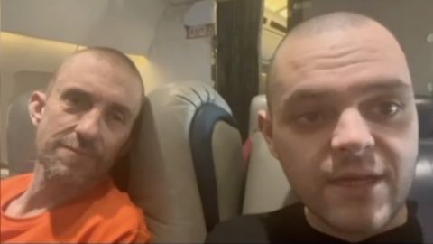 Released British PoWs Shaun Pinner and Aiden Aslin on home-bound airplane on September 22