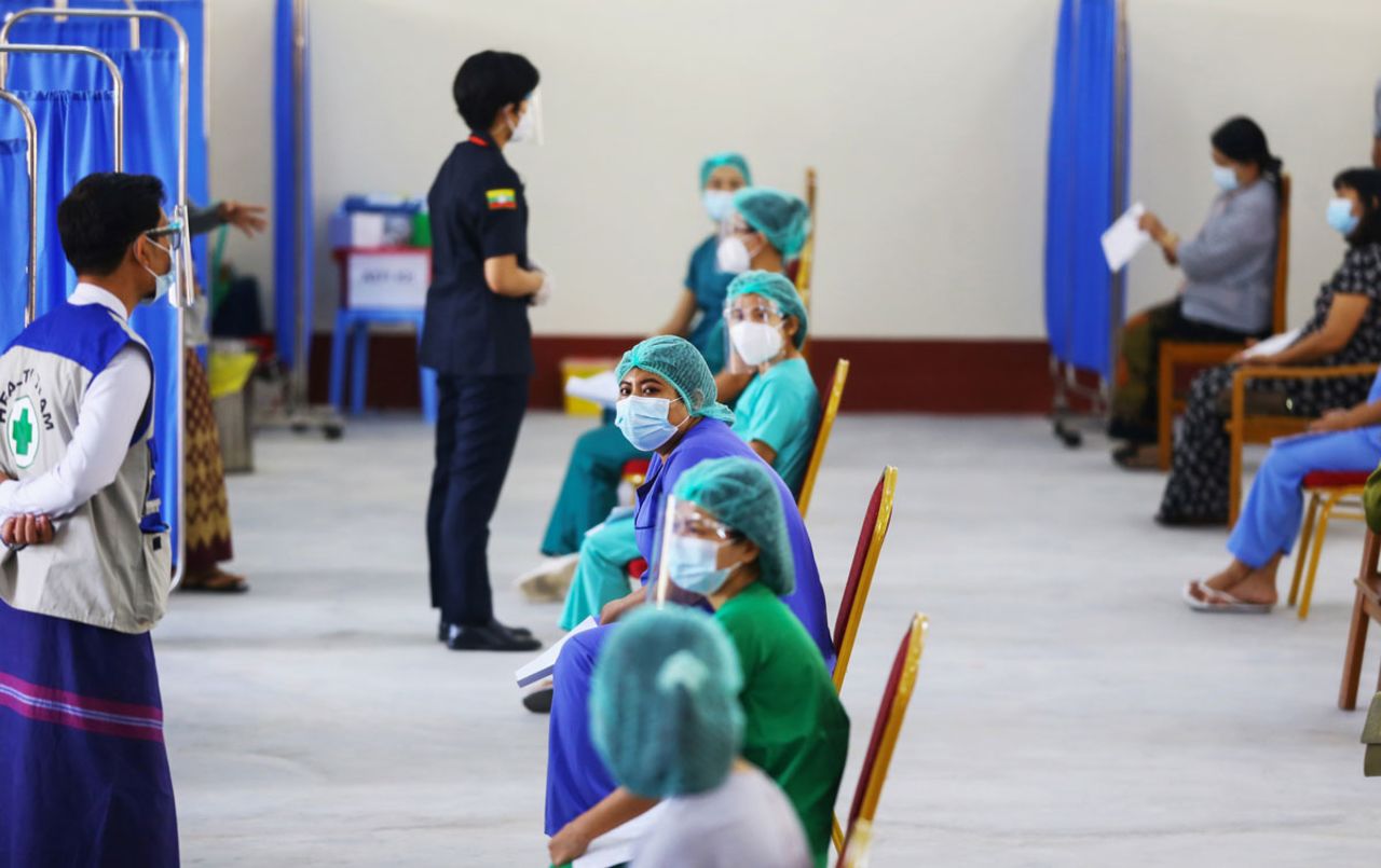 Health workers wait to receive a vaccine for the Covid-19 coronavirus at a hospital in Naypyidaw, Myanmar on January 27.