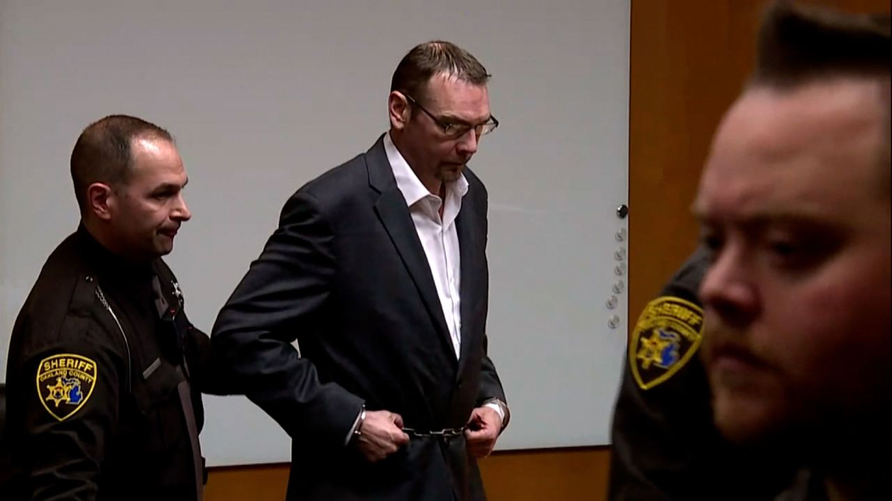 James Crumbley exits the courtroom in handcuffs on March 14. 