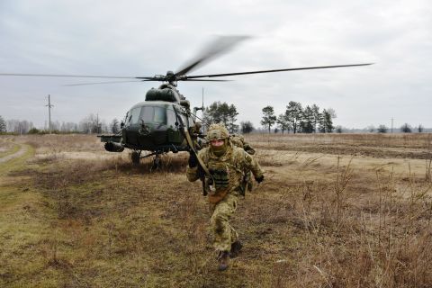Service members of the Ukrainian Air Assault Forces partake in tactical drills at a training ground in an unknown location in Ukraine, on February 18. 