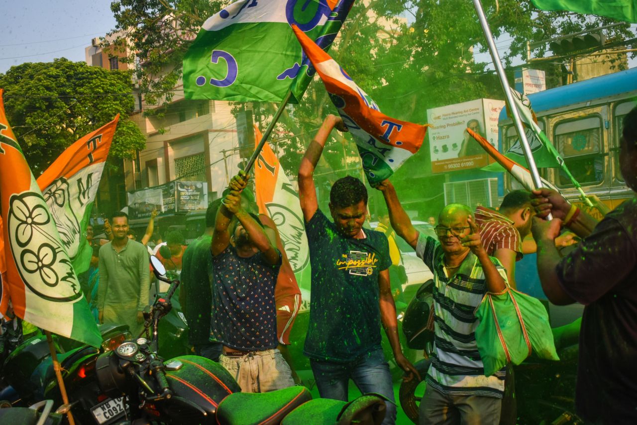 Trinamool Congress party members celebrate in Kolkata on Tuesday.