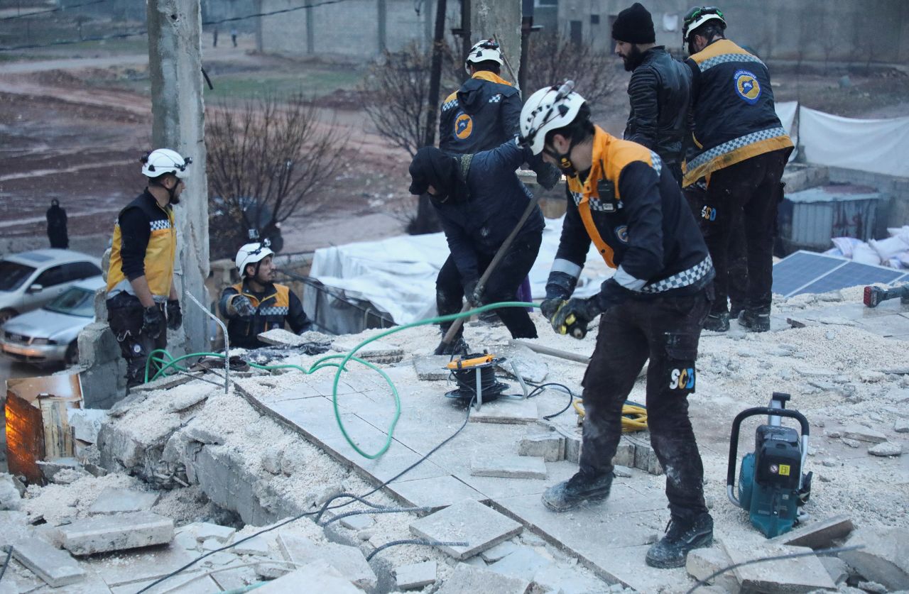 Rescuers work at the site of a damaged building, following an earthquake in Syria, on February 6.