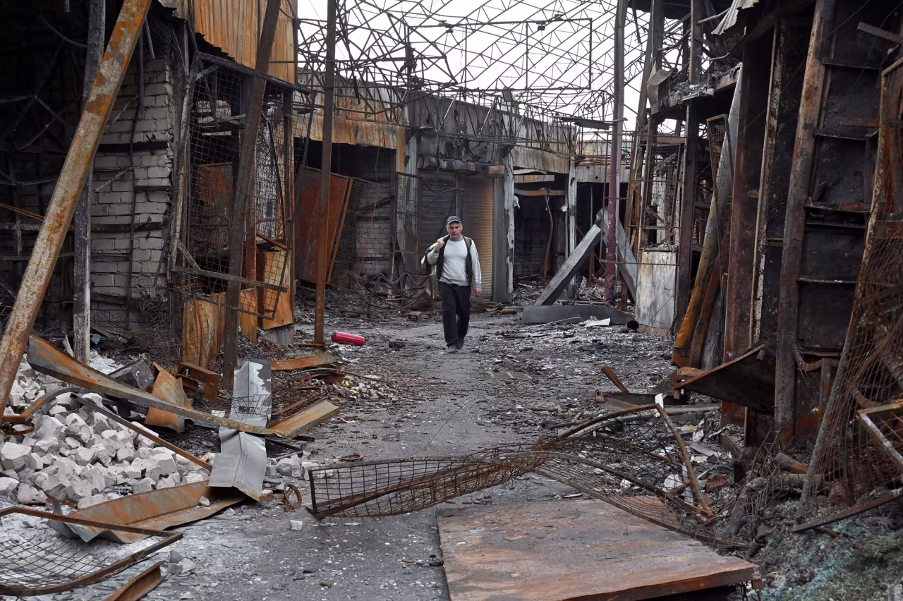 A man walks in a destroyed market in Kharkiv, Ukraine on May 21. 