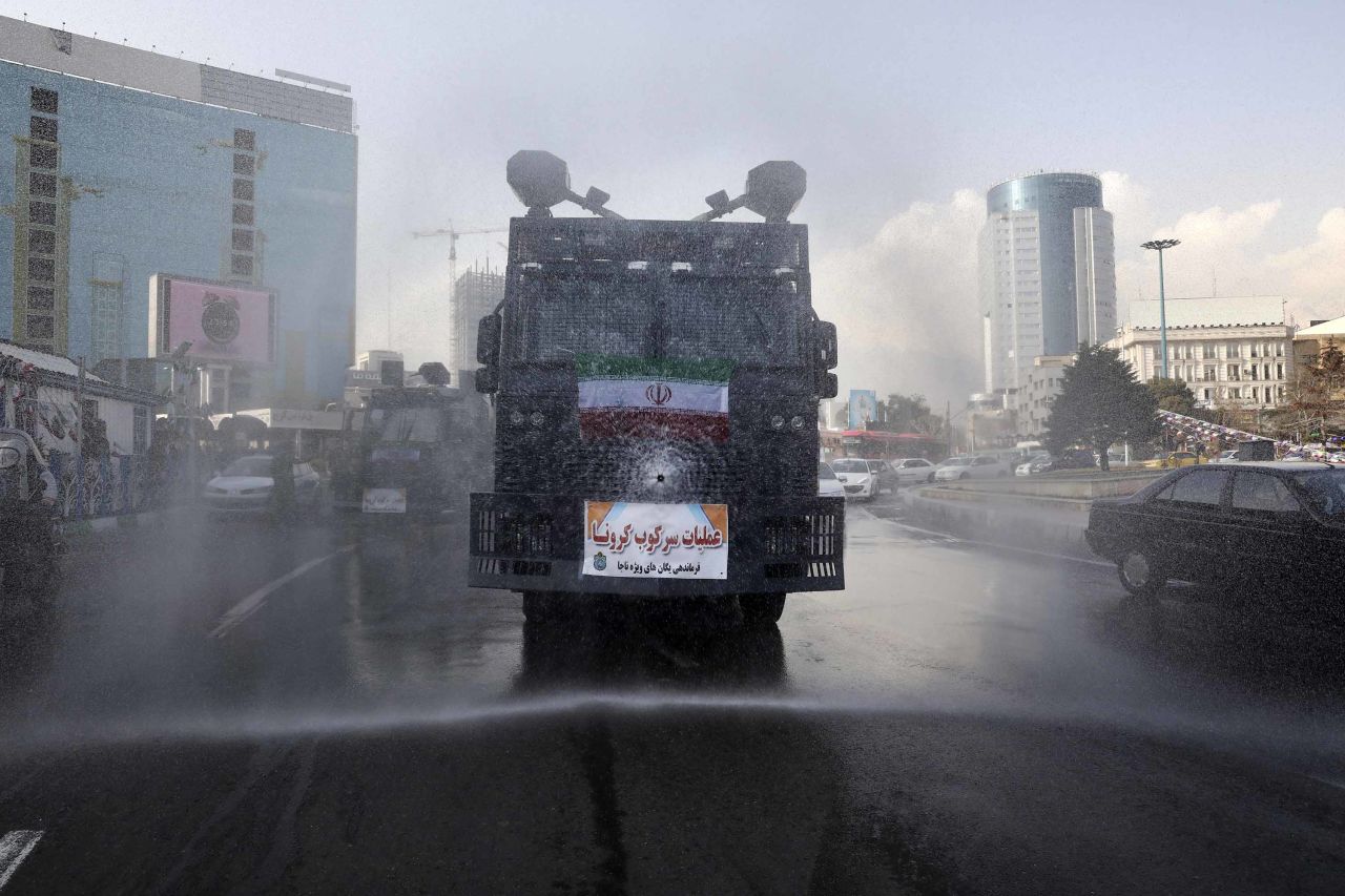 A police vehicle disinfects streets against coronavirus in Tehran, Iran, on March 1.