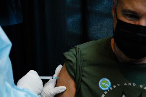 A healthcare worker administers a dose of the Johnson & Johnson Covid-19 vaccine during an event hosted by the Miami Heat at the FTX Arena in Miami, Florida, U.S., on Thursday, Aug. 5, 2021. 