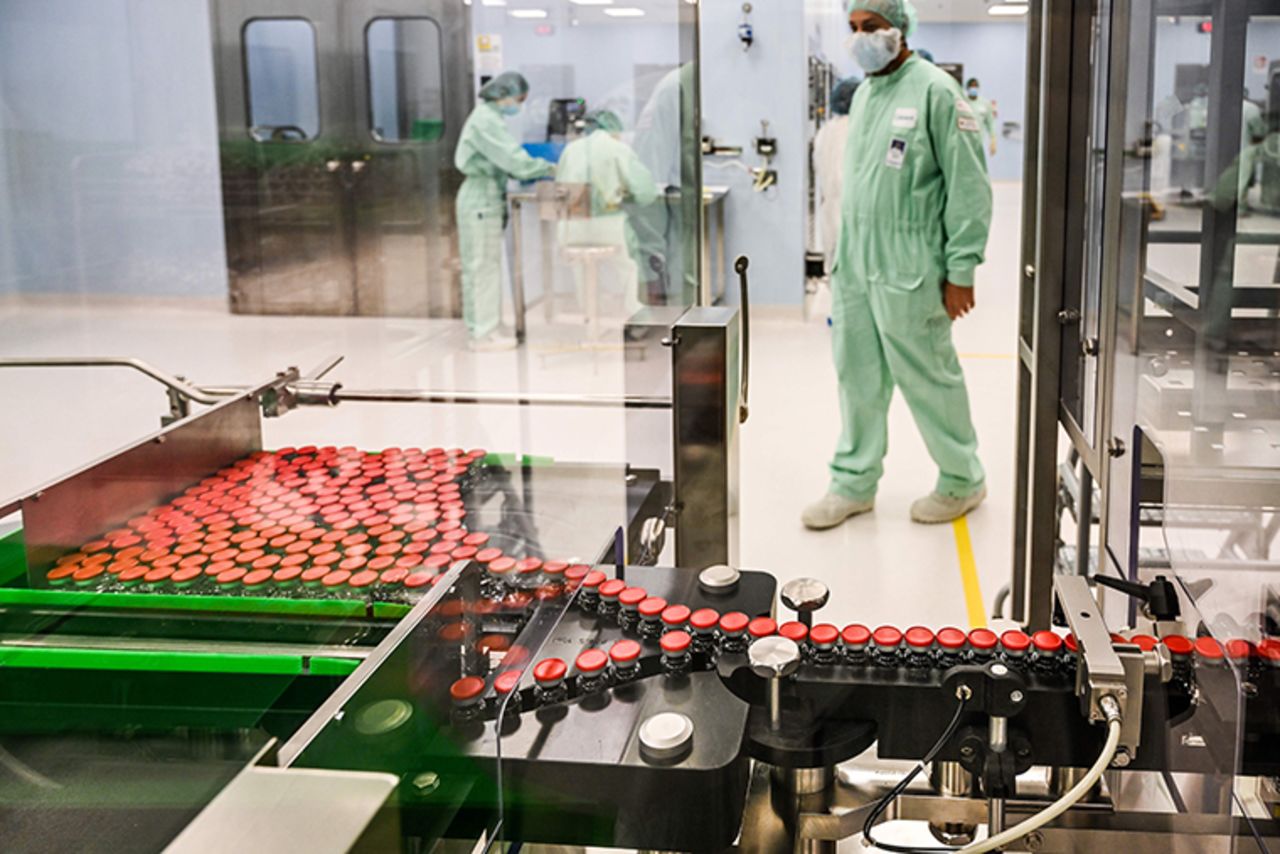 A laboratory technician supervises capped vials during filling and packaging tests for the large-scale production and supply of the University of Oxfords COVID-19 vaccine candidate, AZD1222, conducted on a high-performance aseptic vial filling line on September 11, 2020 at the Italian biologics manufacturing facility of multinational corporation Catalent in Anagni, southeast of Rome