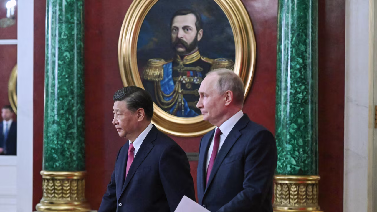 Russian President Vladimir Putin and China's President Xi Jinping arrive for a signing ceremony following their talks at the Kremlin in Moscow on March 21.