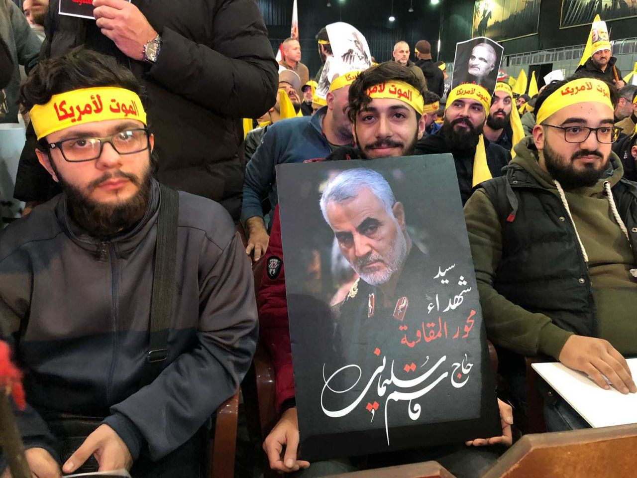 Photo taken from a memorial ceremony in Dahiyeh, the southern suburb of Beirut. The yellow headbands read, "death to America."