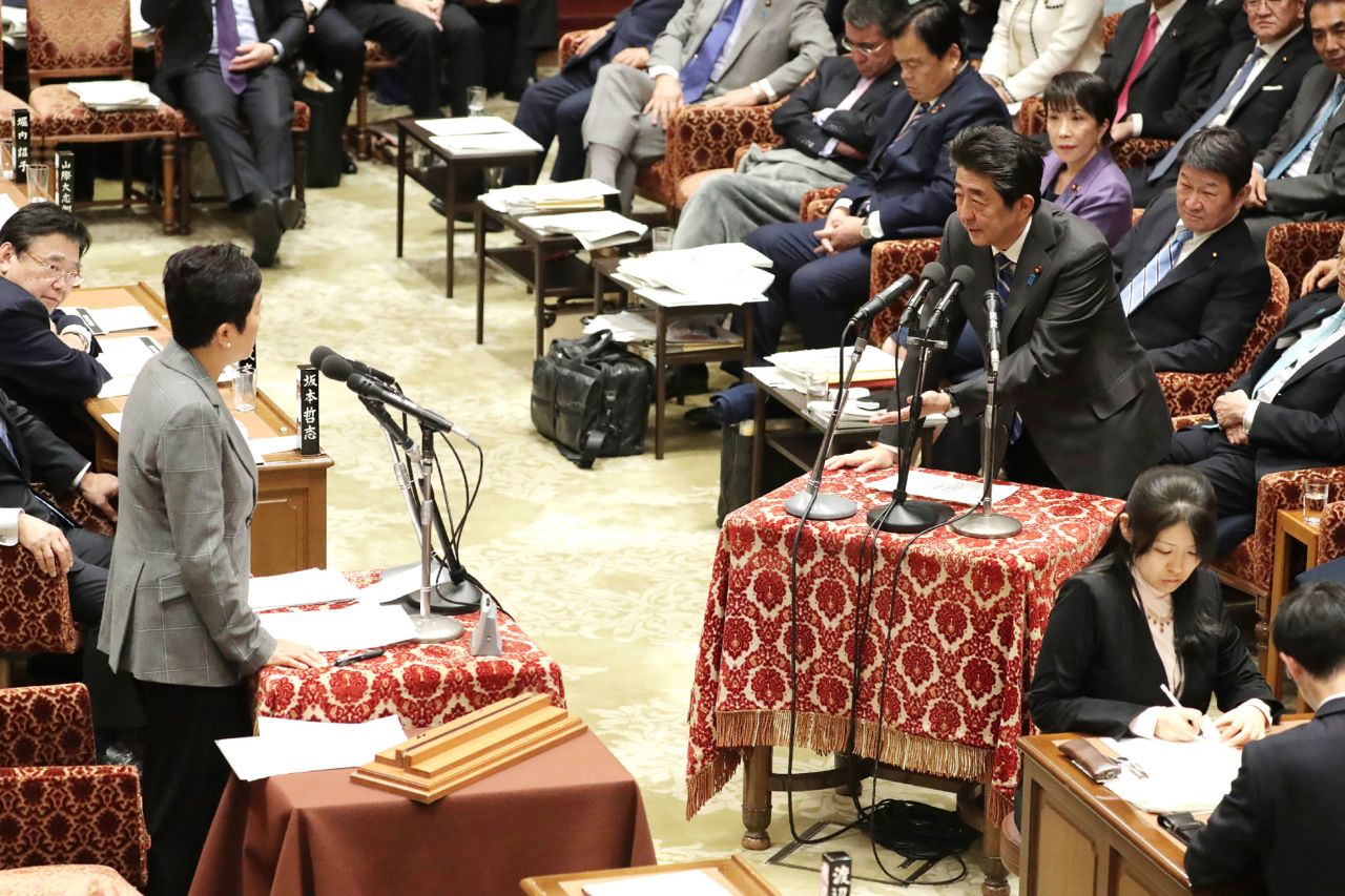 Japan's Prime Minister Shinzo Abe (right) attends a parliament session in Tokyo on February 3.