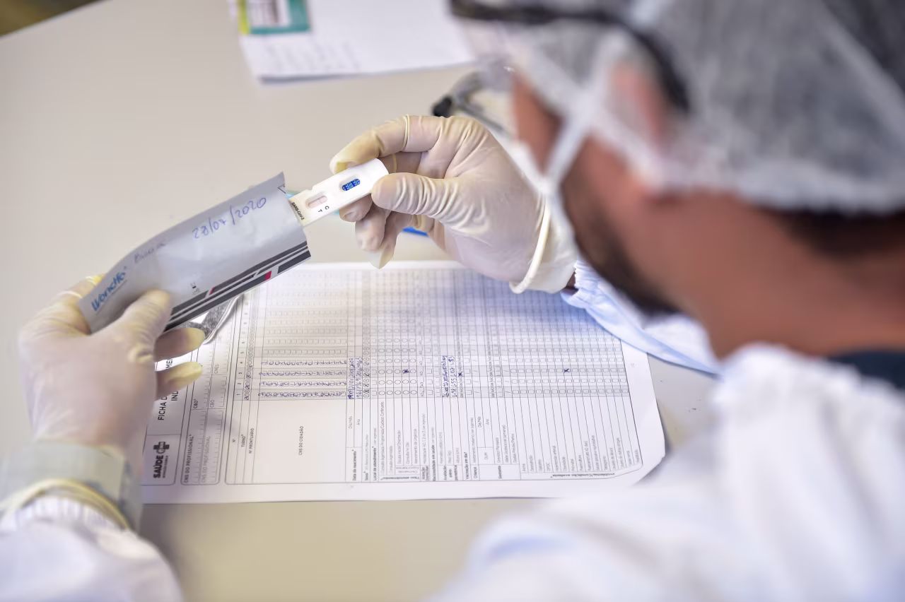 A nurse observes a rapid coronavirus test on July 28 in Ilha de Marajo, Brazil.