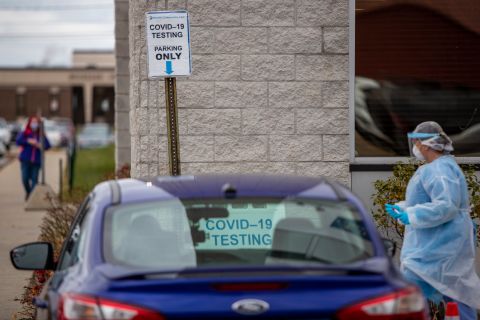 Registered nurse Erica Fairfield, right, works at the Hackley Community Care COVID-19 curbside testing site in Muskegon Heights, Michigan, on November 13. 