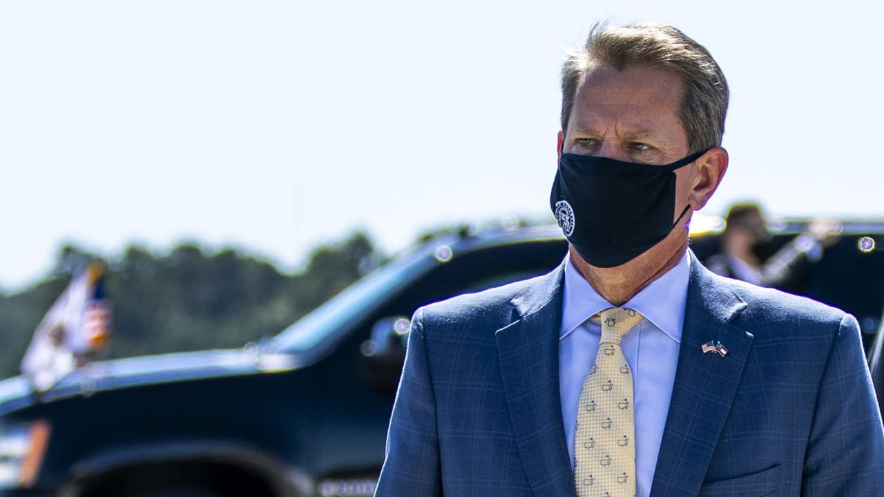 Georgia Gov. Brian Kemp walks away after greeting Vice President Mike Pence as he arrived on Air Force Two at Dobbins Air Reserve Base in Marietta, Georgia, on Wednesday, September 30. 