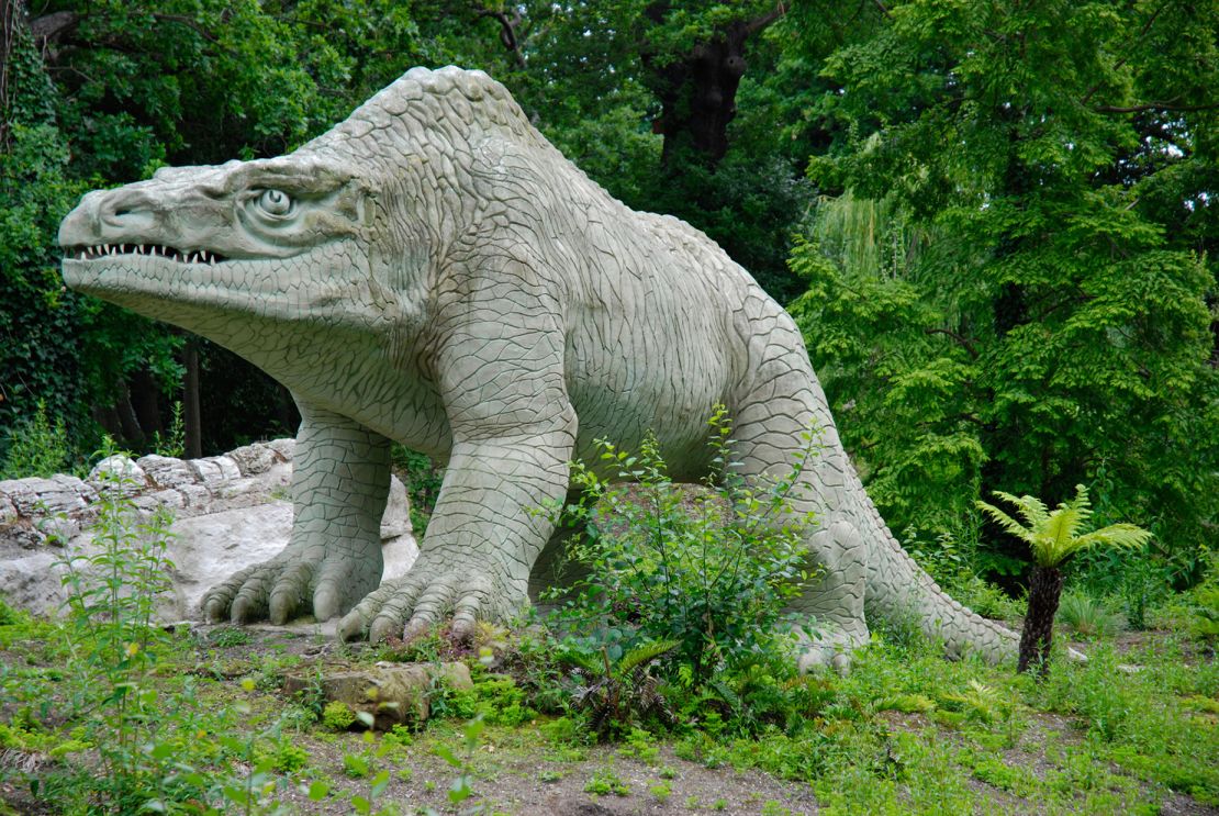 Megalosaurus dinosaur statue in Crystal Palace Park, London.  It was erected in 1854. Paleontologists at the time believed that this prehistoric creature walked on all four legs.