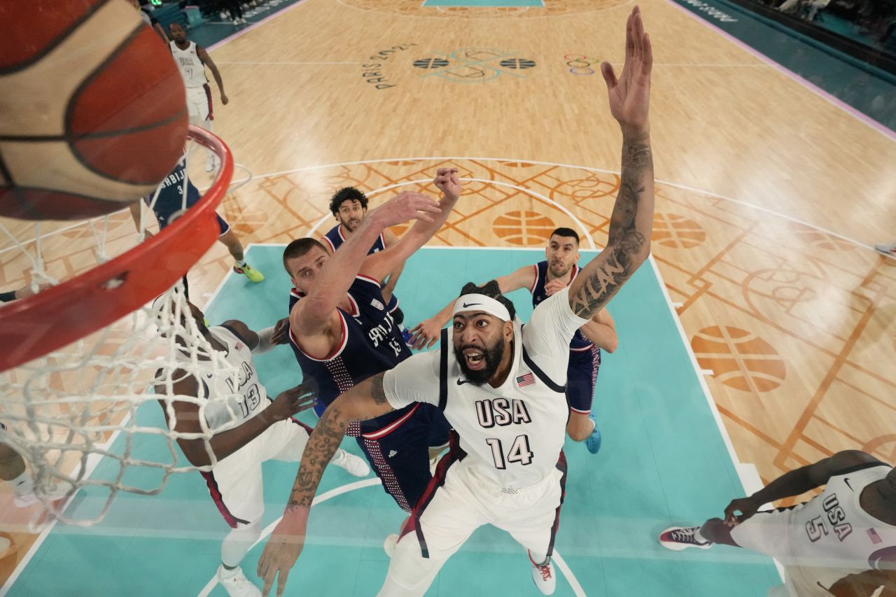 USA's Anthony Davis fights for the ball with Serbia's Nikola Jokic.