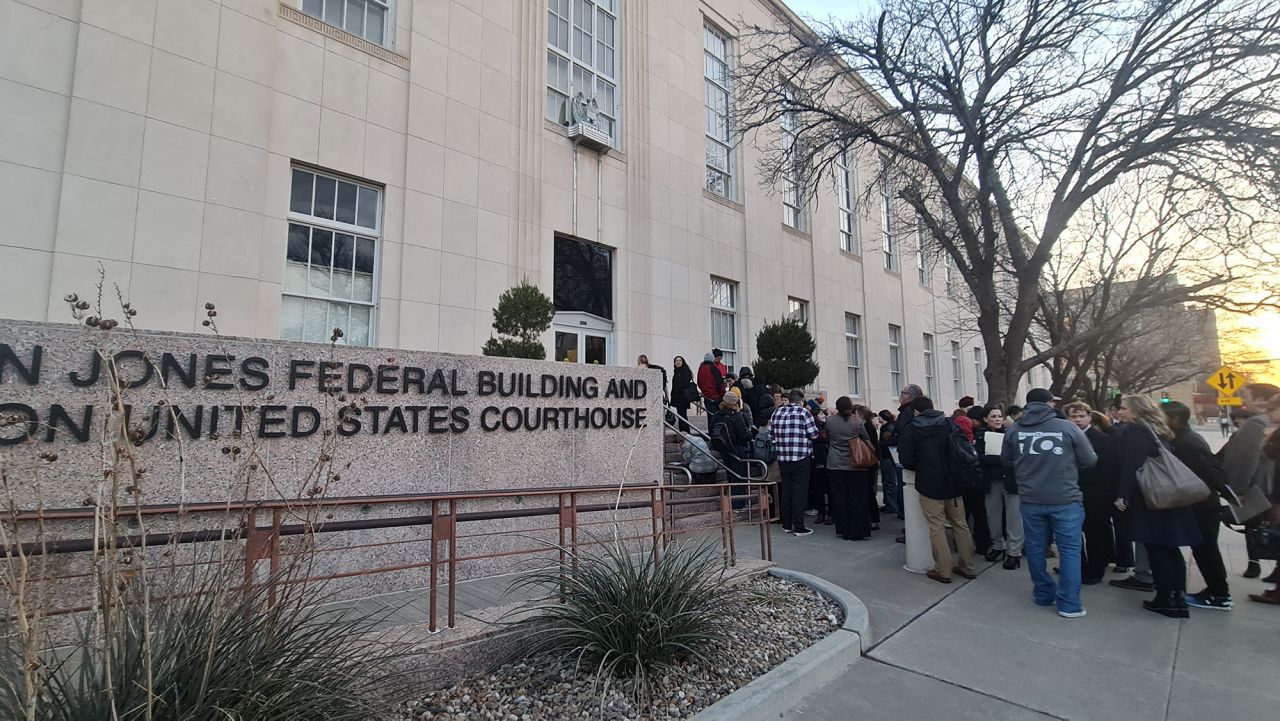 People wait in line to enter the J Marvin Jones Federal Building and Courthouse in Amarillo, Texas, on March 15. 