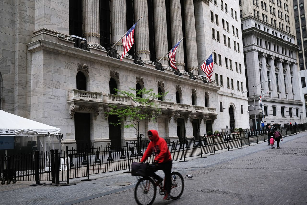 A cyclist passes the New York Stock Exchange in Manhattan on May 18.