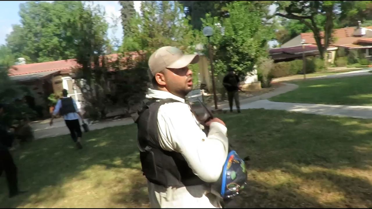 One of the videos shows militants wearing bullet proof vests and wielding rifles can be seen walking through the community and yelling as gunshots ring out in the background.