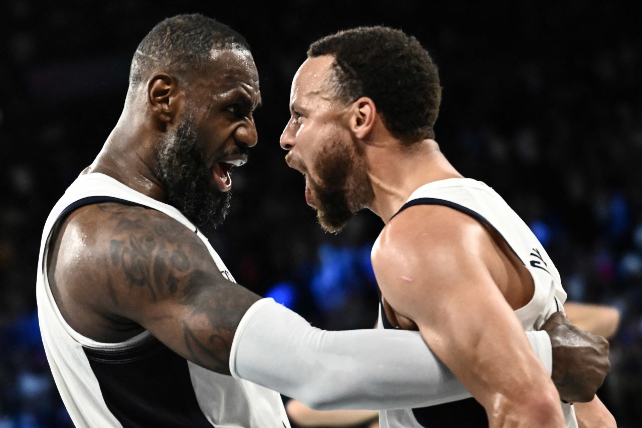 LeBron James and Steph Curry of Team USA celebrate at the end of the men's semifinal basketball match between USA and Serbia on August 8.  