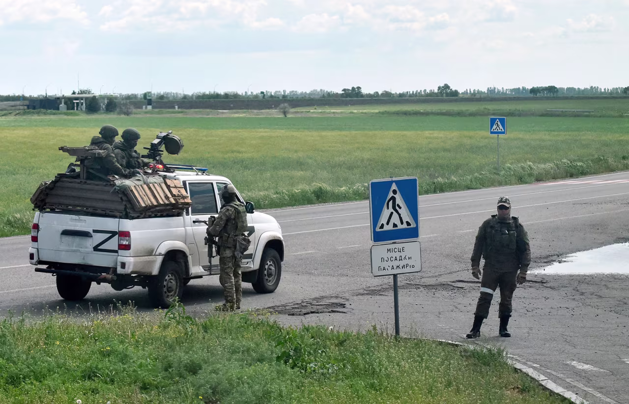 Russian servicemen are seen on a roadside in the Kherson region on May 19. 