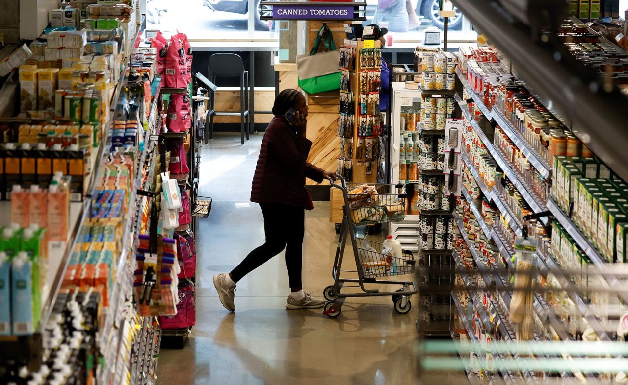 A customer shops at a supermarket in Washington, DC, on October 28. 