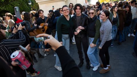 Reed Putnam poses for a photo with onlookers of the Timothée Chalamet lookalike contest in Washington Square Park, New York City, on October 27.