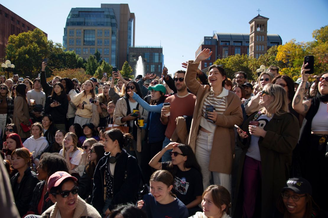 Spectators at the event shout at photographers to move aside so they can see Timothée Chalamet's lookalikes.