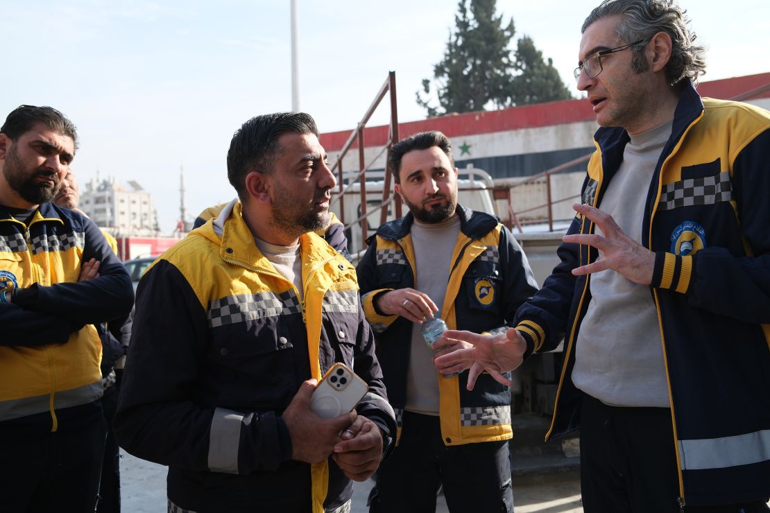 Farouq Habib (right) speaks to the hazmat team ahead of the mission.