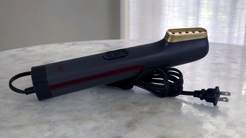 The Chi handheld steamer is compact for travel, and does a great job.