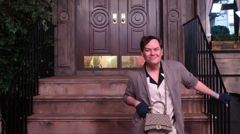 Actor and realtor Christopher Clark poses in front of Carrie Bradshaw's original home in "Sex and the City" and "And Just Like That..."