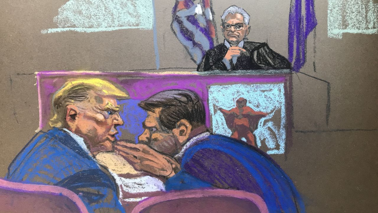 Former President Donald Trump whispers to attorney Todd Blanche during a gag order hearing on Thursday, May 2. Examples of social media were being shown.