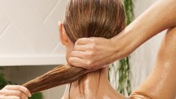 woman washing hair in shower