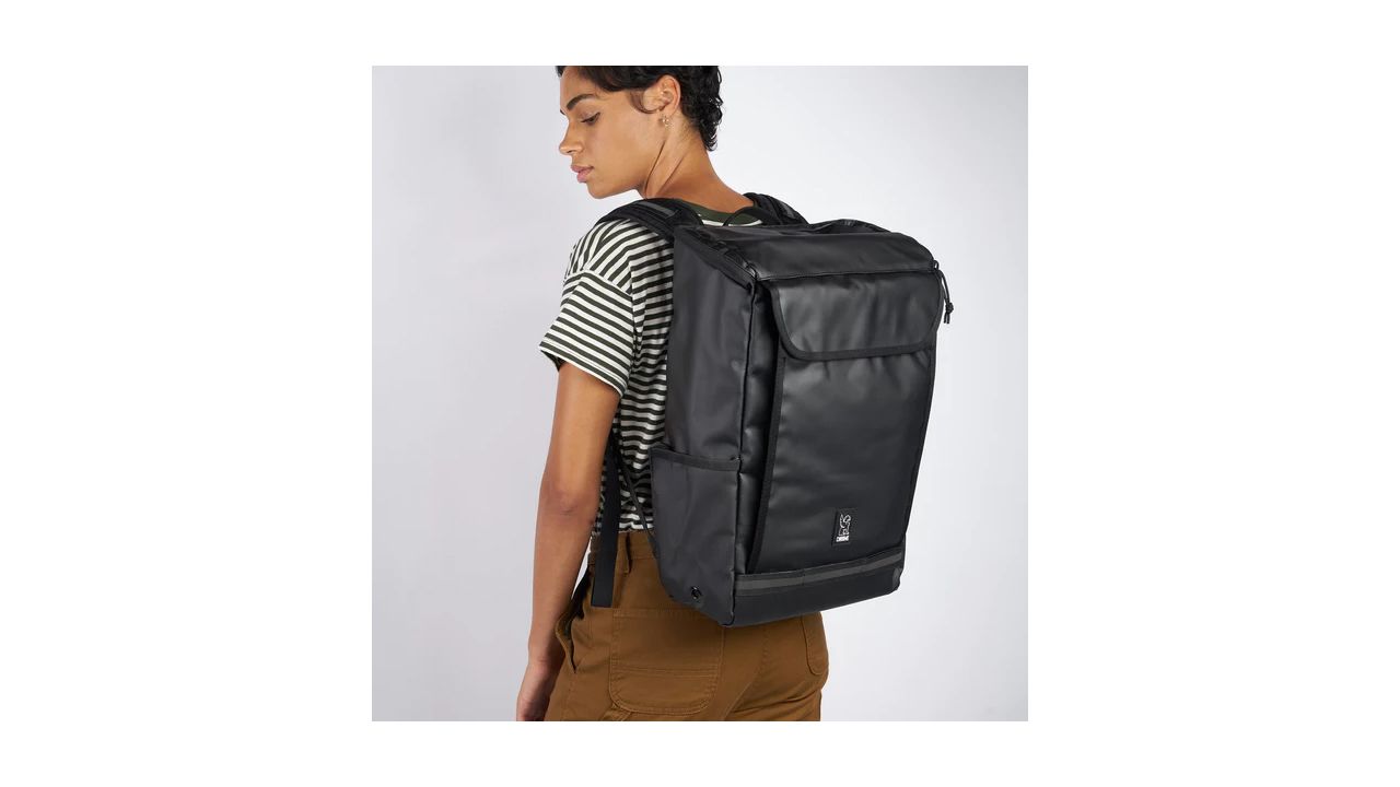 A photo of a person wearing a Volcan backpack from Chrome Industries