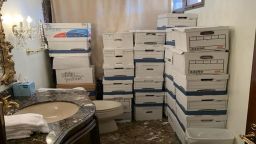This photo from the US Justice Department shows boxes of classified documents stored in a bathroom and shower in the Mar-a-Lago Club.
