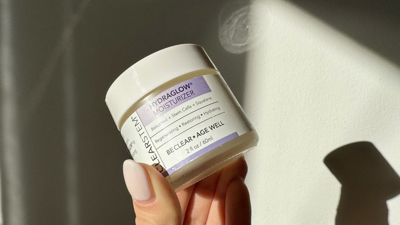 Person holding jar of Clearstem Hydraglow Stem Cell Moisturizer