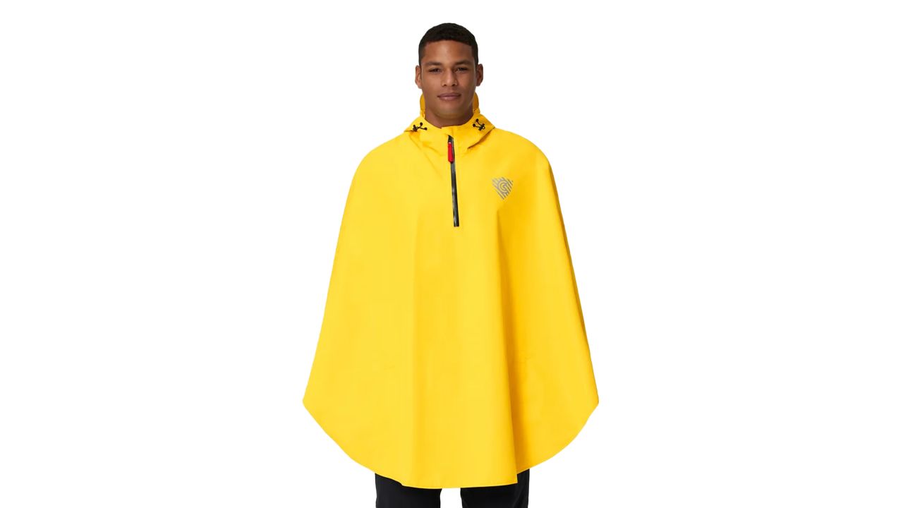 Man wearing yellow Cleverhood Rover Rain Cape