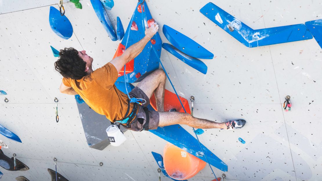 Olympic climber Jesse Grupper climbing at a competition.