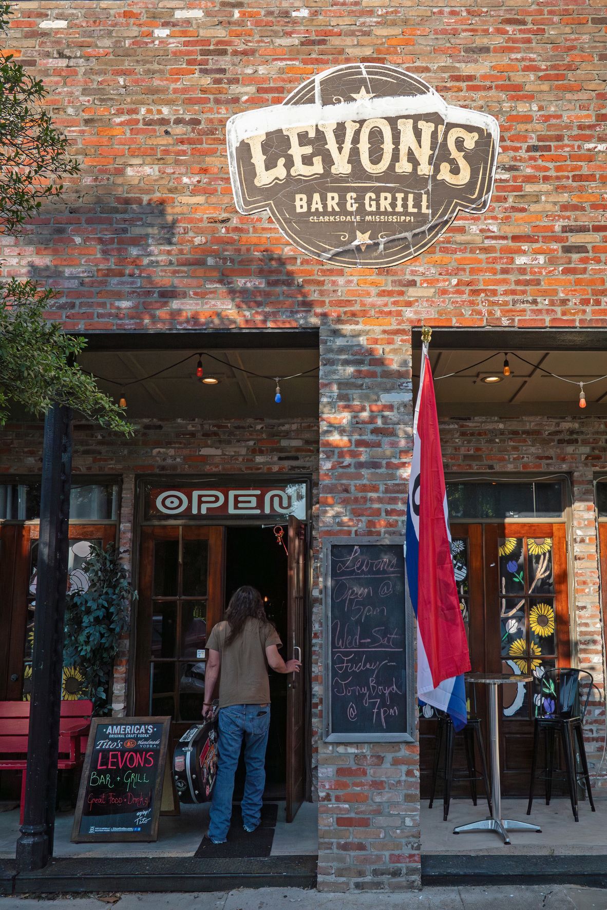<strong>Dining out: </strong>Musician Tony Boyd enters Levon’s Bar & Grill before playing a set on June 6 in Clarksdale.