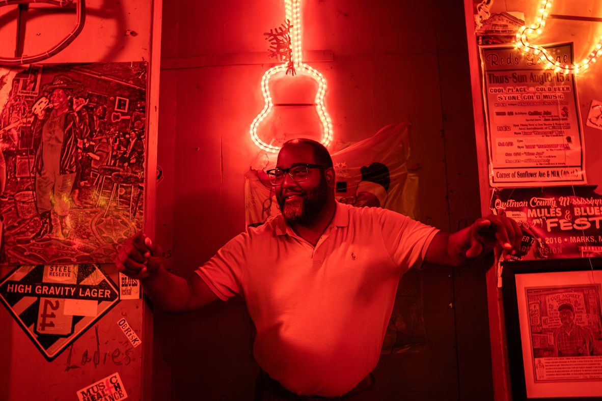 <strong>Red's in red: </strong>Red's owner Orlando Paden poses at the blues club. Live music is available seven days a week in Clarksdale.