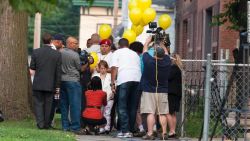 Michelle Knight, center, talks with reporters on Wednesday, August 7,outside the home of Ariel Castro in Cleveland.